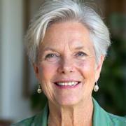 Portrait of Eleanor Vance, a professional woman with a warm, empathetic expression. She has silver hair and is wearing a soft green blouse.
