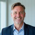 Professional portrait of David Miller, a wellness coach, looking approachable.